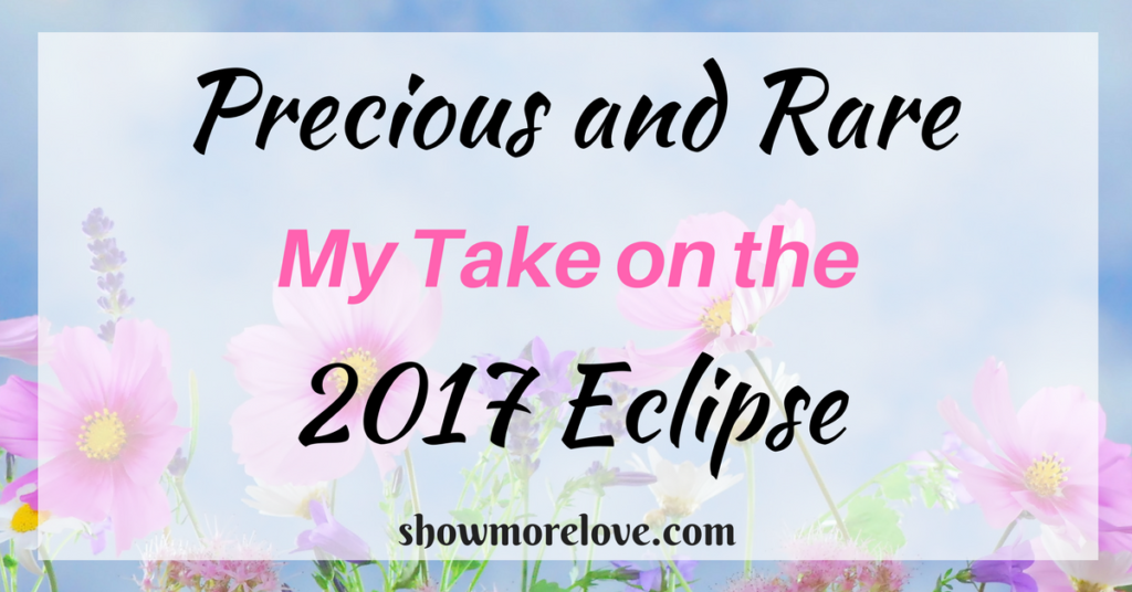 Text: Precious and Rare: My Take on the 2017 Total Eclipse on blue background with pink cosmos and lavender and with showmorelove.com at bottom.